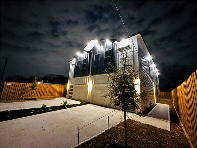 5042 Pershing St Unit Ab, Houston, TX 77033 - property exterior at night featuring a fenced backyard