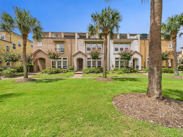 22 Tassia Ln, Pasadena, TX 77058 - view of front of home with stucco siding and a front lawn