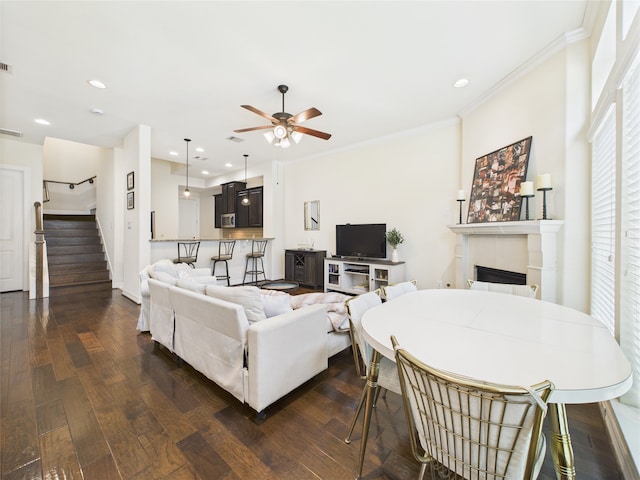 22 Tassia Ln, Pasadena, TX 77058 - living area featuring a ceiling fan, stairway, a fireplace, crown molding, and recessed lighting