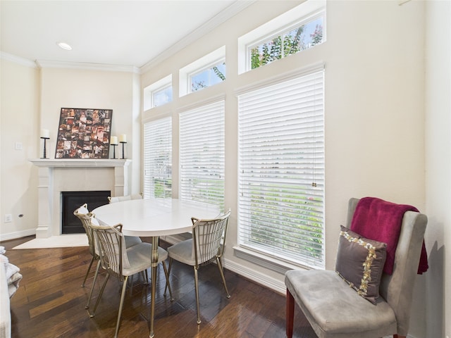 22 Tassia Ln, Pasadena, TX 77058 - dining area with a fireplace with flush hearth, crown molding, wood finished floors, and recessed lighting