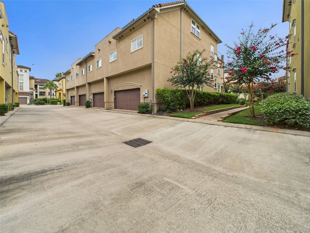 22 Tassia Ln, Pasadena, TX 77058 - view of concrete road featuring a residential view