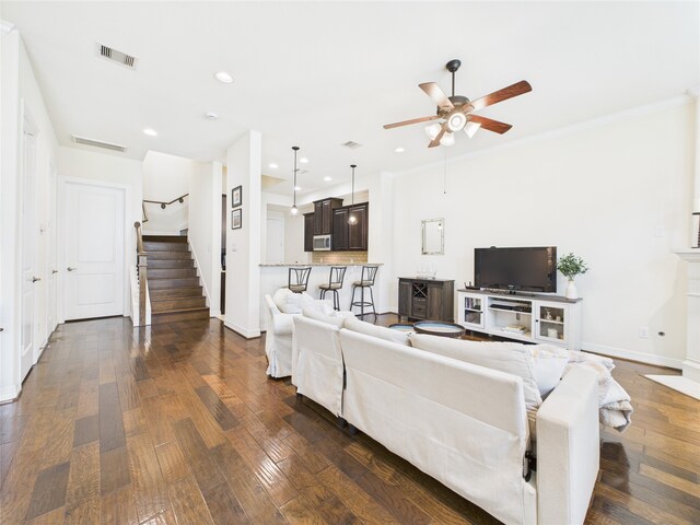 22 Tassia Ln, Pasadena, TX 77058 - living area with stairway, ceiling fan, dark wood-style flooring, recessed lighting, and crown molding
