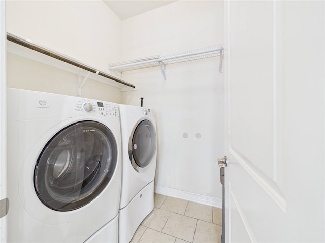 22 Tassia Ln, Pasadena, TX 77058 - laundry room with separate washer and dryer and light tile patterned floors