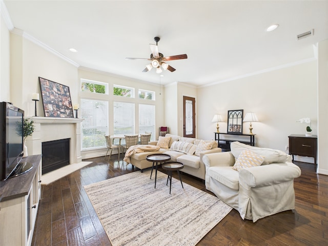 22 Tassia Ln, Pasadena, TX 77058 - living room with ceiling fan, ornamental molding, dark wood finished floors, a fireplace with flush hearth, and recessed lighting