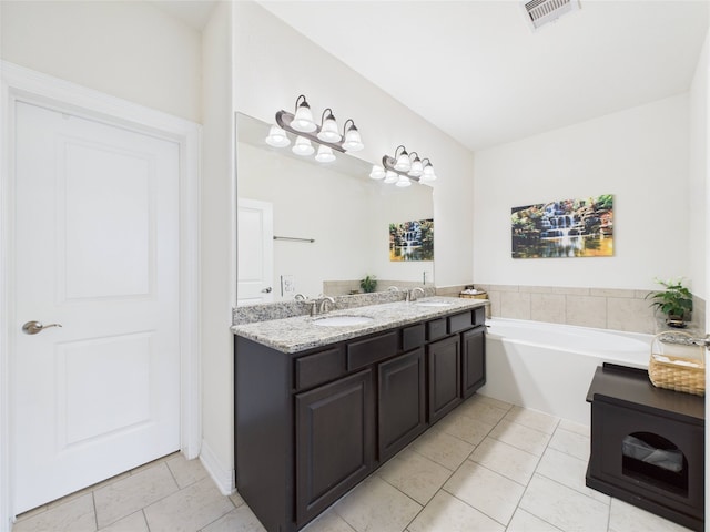 22 Tassia Ln, Pasadena, TX 77058 - bathroom featuring double vanity, tile patterned flooring, and a garden tub