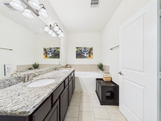 22 Tassia Ln, Pasadena, TX 77058 - bathroom with a bath, double vanity, and tile patterned flooring