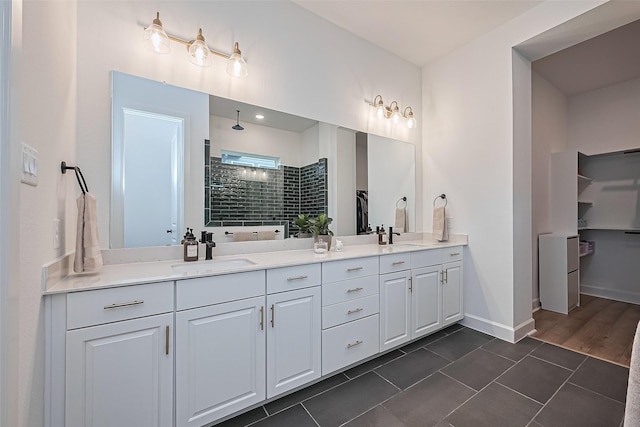 16819 Chapel Knox Dr, Humble, TX 77346 - full bathroom with double vanity, tiled shower, a spacious closet, and tile patterned floors