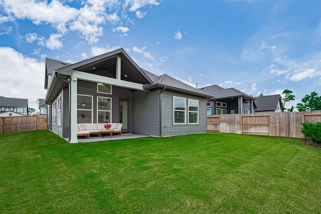 16819 Chapel Knox Dr, Humble, TX 77346 - back of house with an outdoor living space, a fenced backyard, a patio, and a sunroom