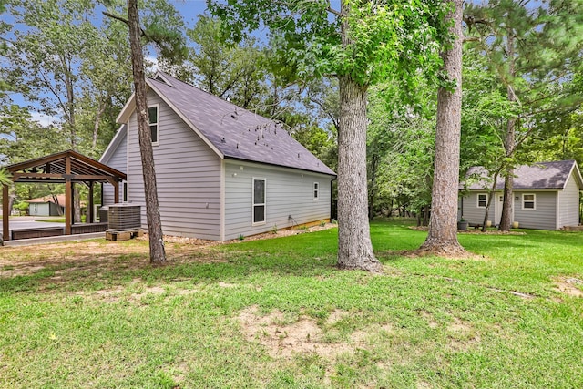 561 N Royale Greens Dr, Coldspring, TX 77331 - view of property exterior with a gazebo, a yard, and a shingled roof