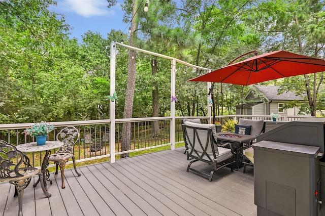 561 N Royale Greens Dr, Coldspring, TX 77331 - wooden terrace featuring an outdoor fire pit