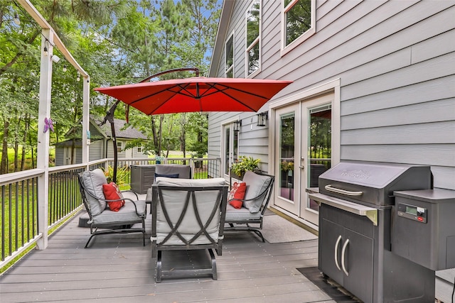 561 N Royale Greens Dr, Coldspring, TX 77331 - deck with outdoor dining space, area for grilling, and french doors