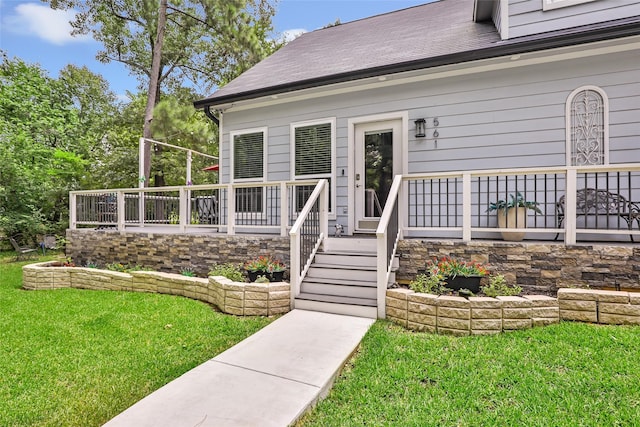 561 N Royale Greens Dr, Coldspring, TX 77331 - property entrance featuring a yard and roof with shingles