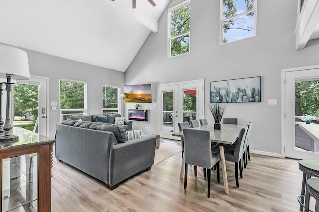 561 N Royale Greens Dr, Coldspring, TX 77331 - living room featuring high vaulted ceiling, light wood-style floors, french doors, beam ceiling, and ceiling fan