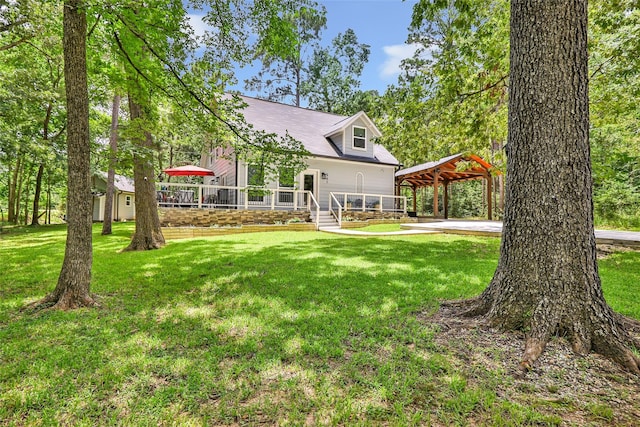 561 N Royale Greens Dr, Coldspring, TX 77331 - view of grassy yard with a deck, a gazebo, and a detached carport