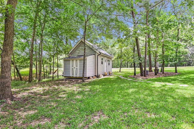 561 N Royale Greens Dr, Coldspring, TX 77331 - view of grassy yard featuring an outdoor structure