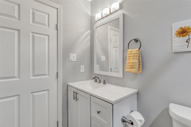 561 N Royale Greens Dr, Coldspring, TX 77331 - half bath featuring vanity and toilet