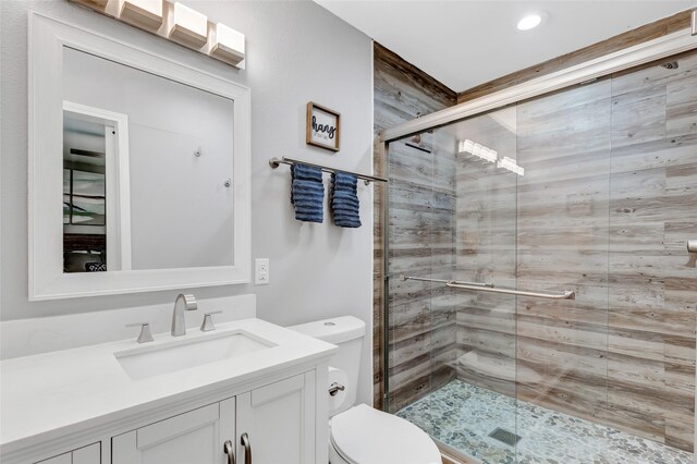 561 N Royale Greens Dr, Coldspring, TX 77331 - full bath featuring vanity, a stall shower, and recessed lighting