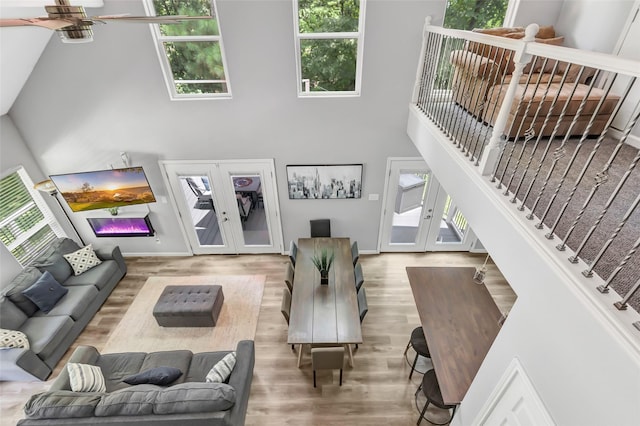 561 N Royale Greens Dr, Coldspring, TX 77331 - living room with french doors, a towering ceiling, wood finished floors, and ceiling fan