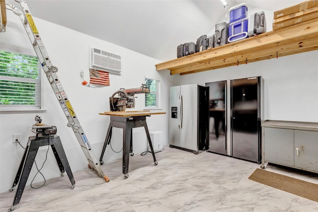 561 N Royale Greens Dr, Coldspring, TX 77331 - kitchen with stainless steel refrigerator with ice dispenser, freestanding refrigerator, an AC wall unit, and light marble finish floors