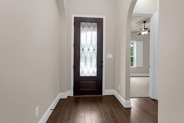 54 N Lochwood Way, Tomball, TX 77375 - entrance foyer with dark wood finished floors, arched walkways, and ceiling fan