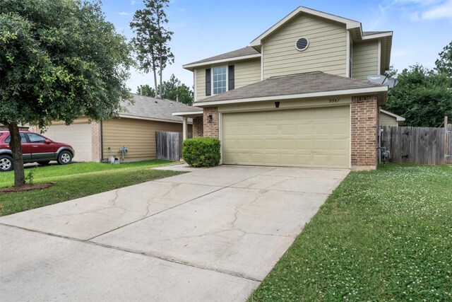 9987 Sterling Place Dr, Conroe, TX 77303 - traditional-style home featuring brick siding, driveway, and an attached garage