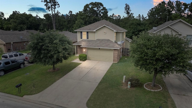 9987 Sterling Place Dr, Conroe, TX 77303 - view of front of home featuring brick siding, concrete driveway, a front lawn, roof with shingles, and a garage