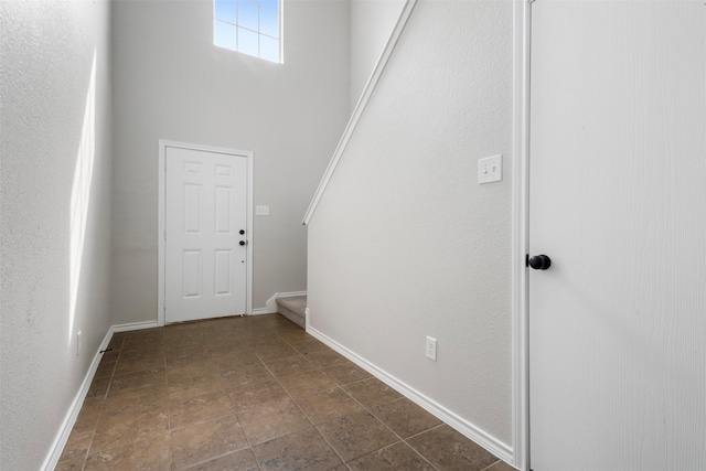 9987 Sterling Place Dr, Conroe, TX 77303 - foyer featuring stairs and dark stone finish floors