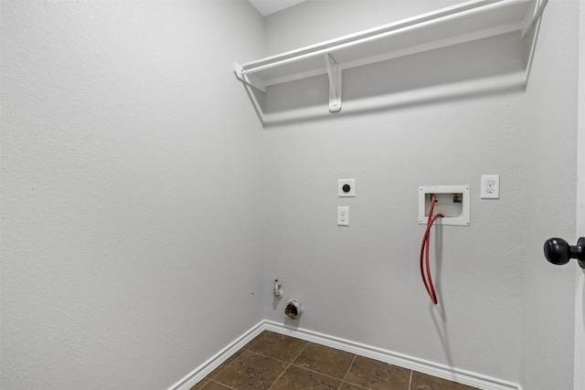 9987 Sterling Place Dr, Conroe, TX 77303 - laundry room featuring hookup for an electric dryer, dark tile patterned flooring, hookup for a washing machine, and gas dryer hookup