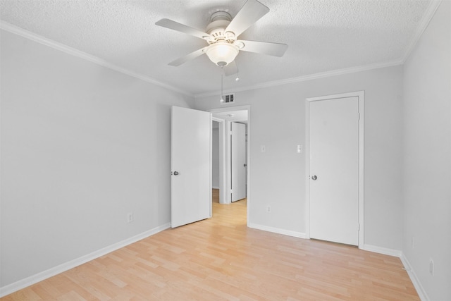 2800 Jeanetta St Unit 2502, Houston, TX 77063 - unfurnished bedroom featuring light wood-style flooring, a textured ceiling, crown molding, and a ceiling fan