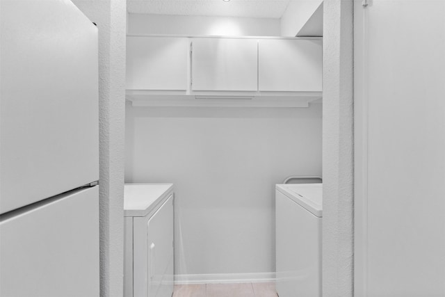 2800 Jeanetta St Unit 2502, Houston, TX 77063 - laundry room with separate washer and dryer and light tile patterned floors