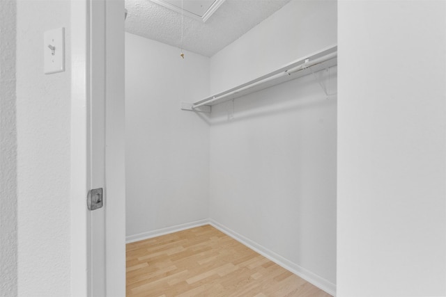 2800 Jeanetta St Unit 2502, Houston, TX 77063 - spacious closet with attic access and wood finished floors