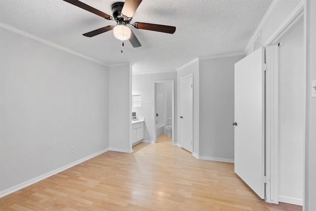 2800 Jeanetta St Unit 2502, Houston, TX 77063 - unfurnished bedroom featuring light wood-style flooring, a textured ceiling, ensuite bathroom, ornamental molding, and a ceiling fan