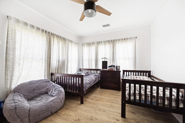 1507 Brooks Ave, Rosenberg, TX 77471 - bedroom with wood finished floors and a ceiling fan