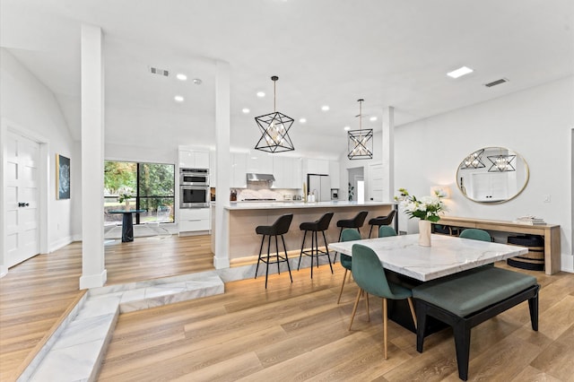 10826 Moonlight Dr, Houston, TX 77096 - dining room featuring recessed lighting and light wood-style flooring