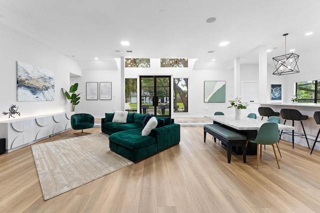 10826 Moonlight Dr, Houston, TX 77096 - living room with light wood-type flooring, recessed lighting, and a chandelier