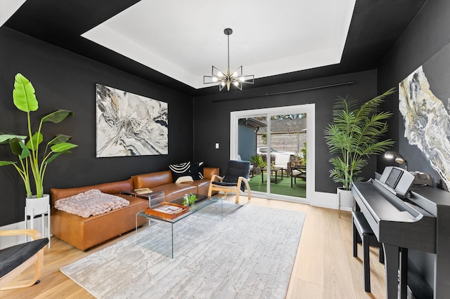 10826 Moonlight Dr, Houston, TX 77096 - living area with a tray ceiling, wood finished floors, and a chandelier