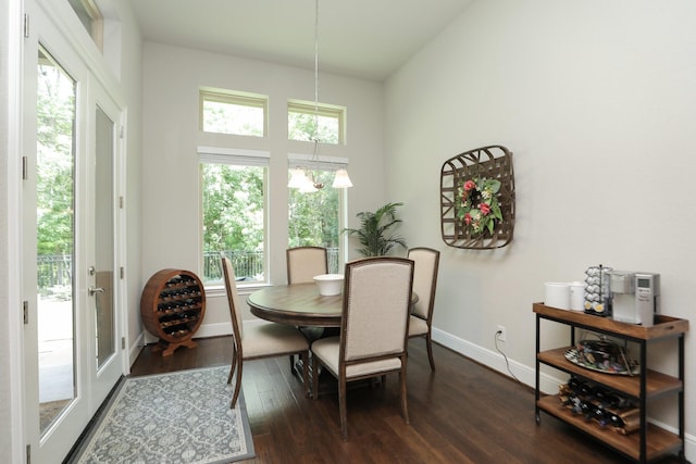 8511 Tynan Ridge Dr, Magnolia, TX 77354 - dining space with dark wood-style flooring and baseboards
