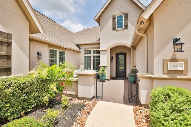 8511 Tynan Ridge Dr, Magnolia, TX 77354 - entrance to property with a gate, stucco siding, and a shingled roof