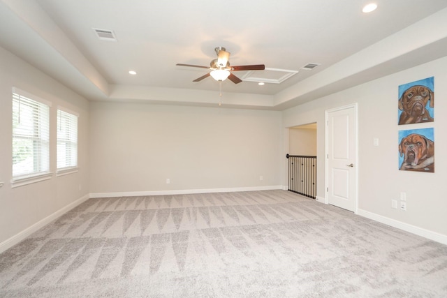 8511 Tynan Ridge Dr, Magnolia, TX 77354 - unfurnished bedroom with light carpet, a tray ceiling, recessed lighting, and ceiling fan