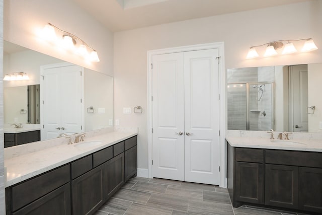 8511 Tynan Ridge Dr, Magnolia, TX 77354 - bathroom with a shower stall and two vanities