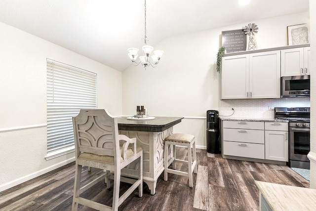 12223 Paddock Way, Houston, TX 77065 - dining room with vaulted ceiling, dark wood-type flooring, and a chandelier