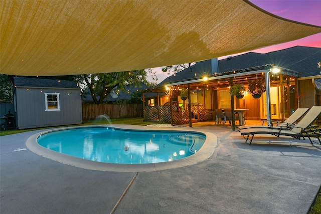 12223 Paddock Way, Houston, TX 77065 - view of swimming pool featuring a patio area, a shed, and outdoor dining space