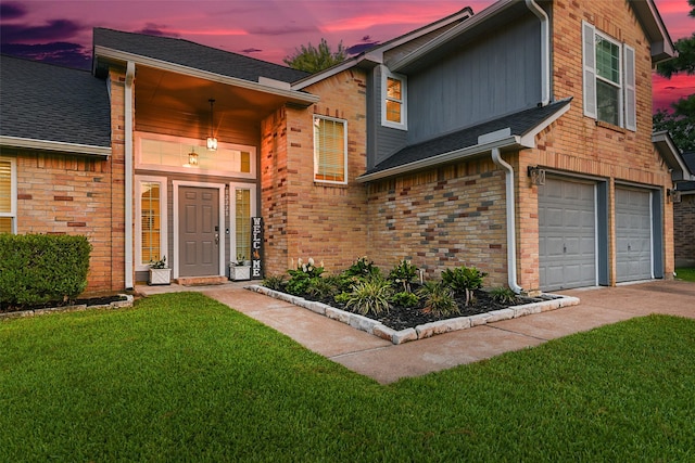 12223 Paddock Way, Houston, TX 77065 - view of front of property featuring a front yard, an attached garage, concrete driveway, brick siding, and roof with shingles