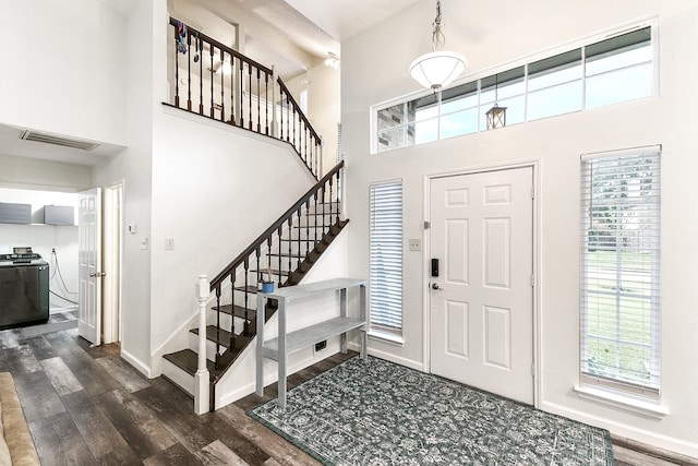 12223 Paddock Way, Houston, TX 77065 - foyer with dark wood-type flooring, stairway, and a towering ceiling