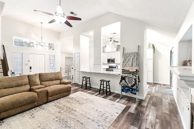 12223 Paddock Way, Houston, TX 77065 - living area with ceiling fan, dark wood finished floors, and high vaulted ceiling