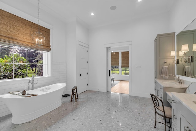 37732 Marias Way, Magnolia, TX 77354 - bathroom featuring a freestanding tub, vanity, and recessed lighting