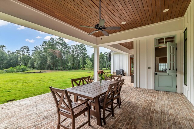 37732 Marias Way, Magnolia, TX 77354 - view of patio featuring outdoor dining area, ceiling fan, and view of scattered trees