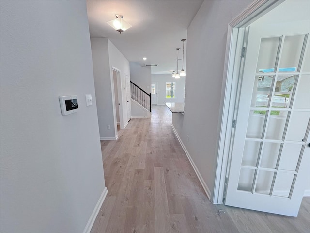 32402 Fly Fish Way, Fulshear, TX 77441 - hallway featuring light wood-type flooring and stairway