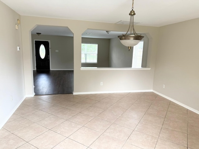 3403 Fox Ct, Pearland, TX 77581 - tiled spare room with baseboards and arched walkways