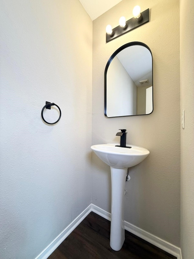 3403 Fox Ct, Pearland, TX 77581 - bathroom featuring wood finished floors and baseboards